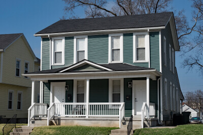 Exterior of blue duplex investment property.