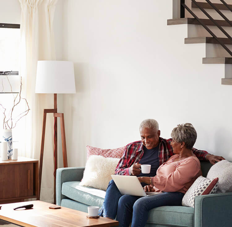 An older couple inquiring what a HECM loan is and if they meet HECM requirements