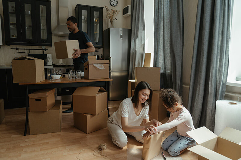 Homeowners packing up their kitchen to prepare for their move