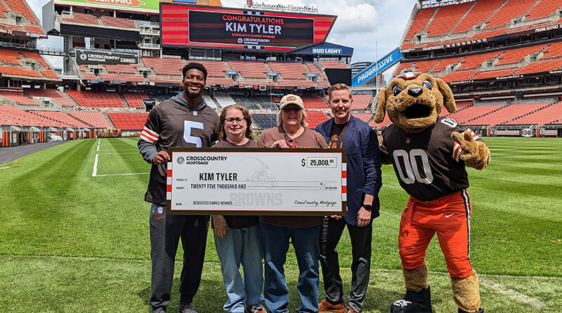 Kim Tyler of Parma, Ohio is the winner of the $25,000 grand prize in the CrossCountry Mortgage (CCM) Dedicated Dawgs Sweepstakes