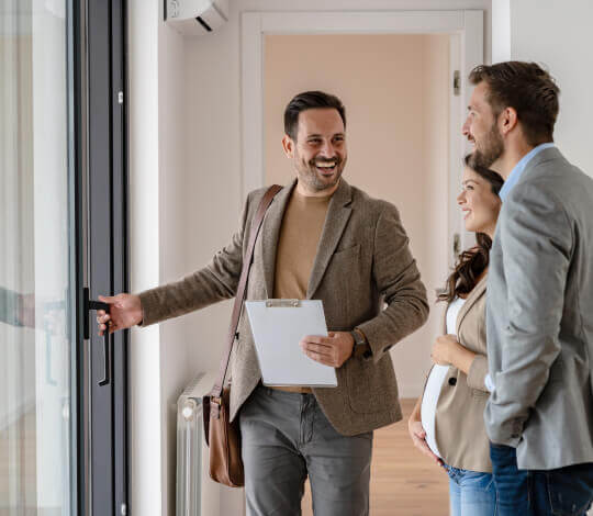 Couple meets with REALTOR to buy a house.