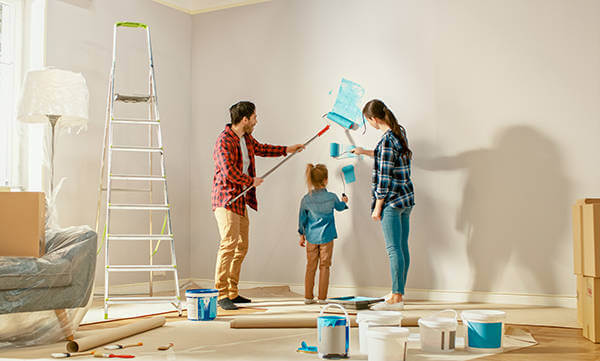 Family painting and doing renovations on their fixer-upper