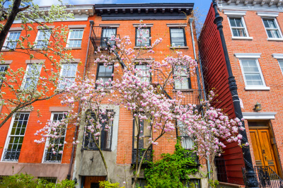 Outside of a brick condo in NYC that is available to buy.