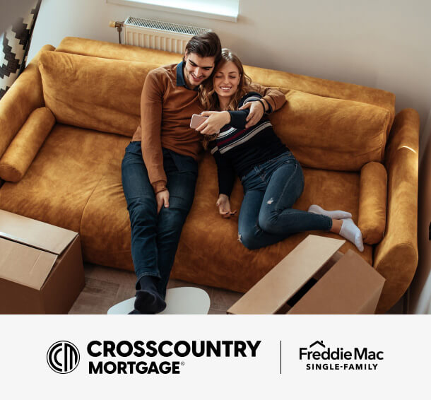 First time homebuyers relaxing in the living room of their new home