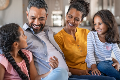 Hispanic family laughing together