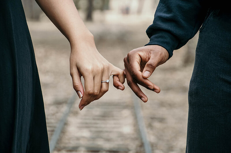 Married couple holding hands